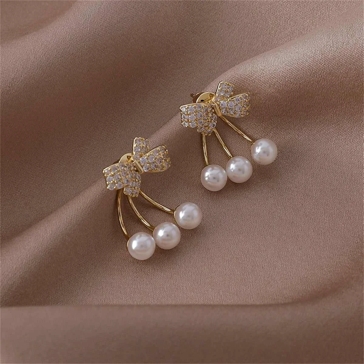 Selected Cubic Zirconia Pearl Goldtone Bow Ear Jackets Green