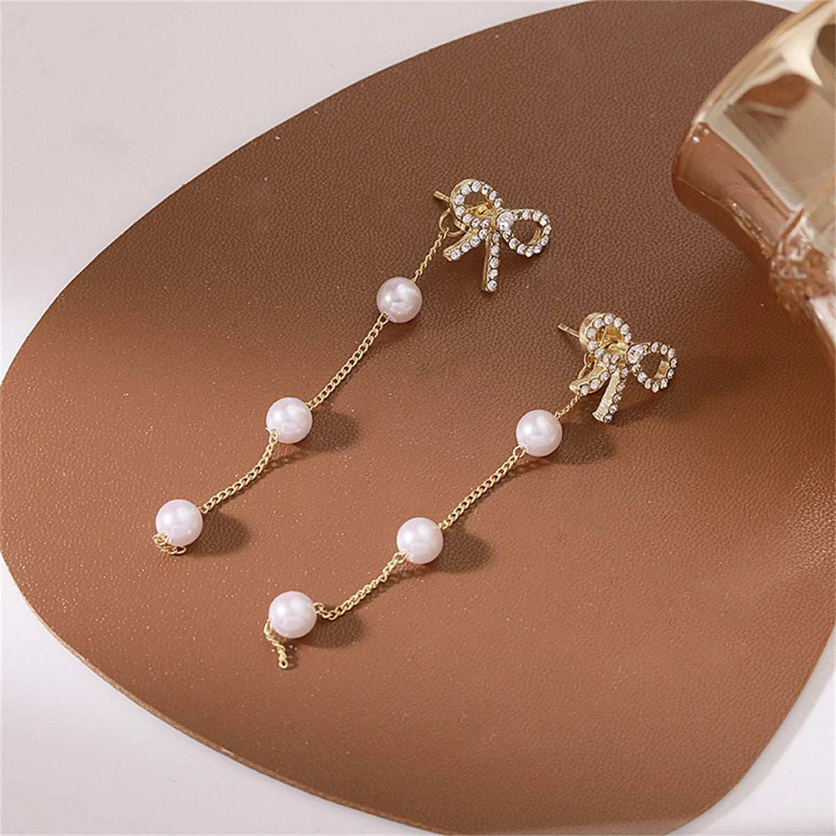 Eco-Friendly Cubic Zirconia Pearl Goldtone Bow Dangle Ear Jackets Innovative