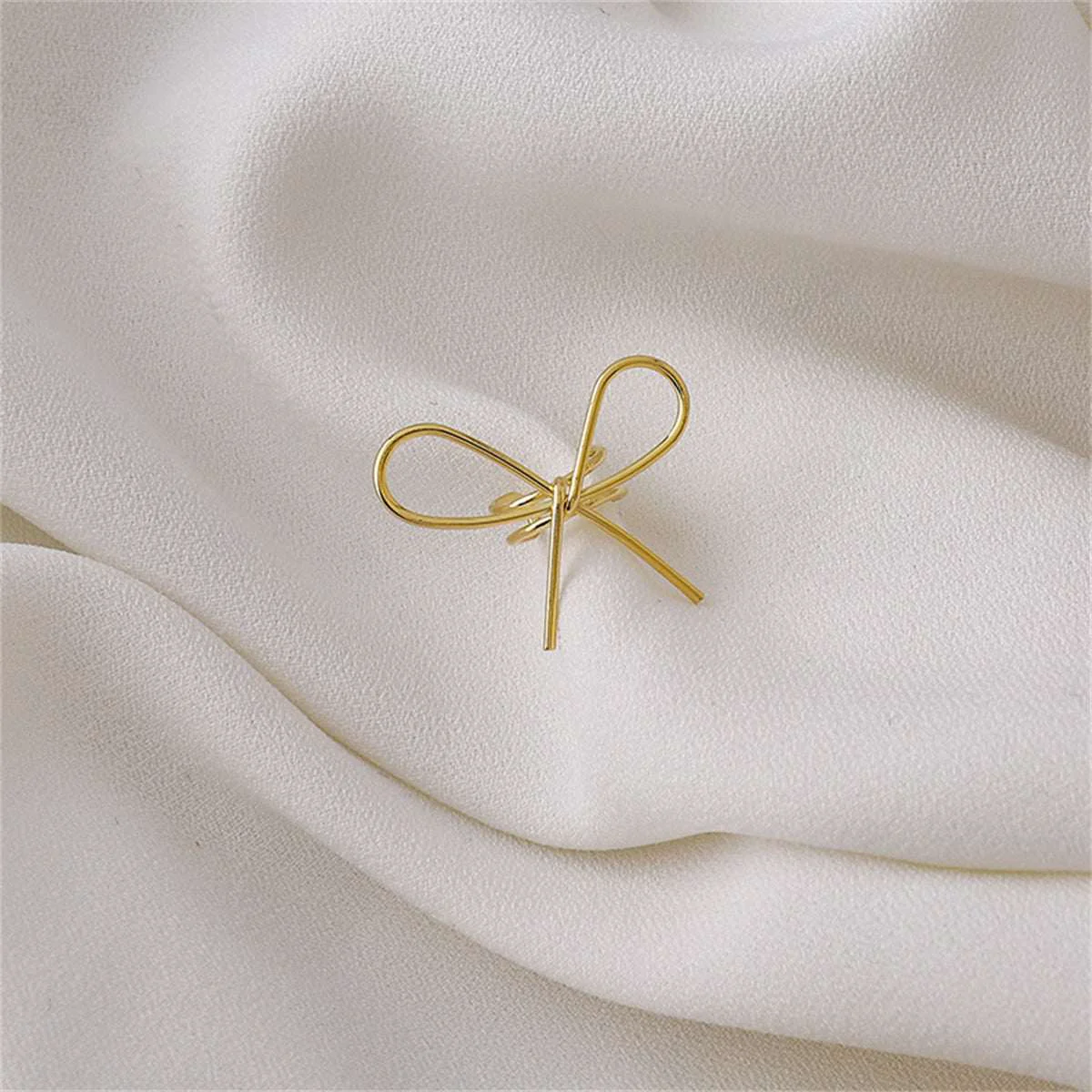 Artisan Goldtone Bow Ear Cuff Solid